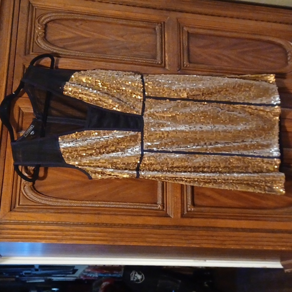 Black with gold sequin size LG dress.